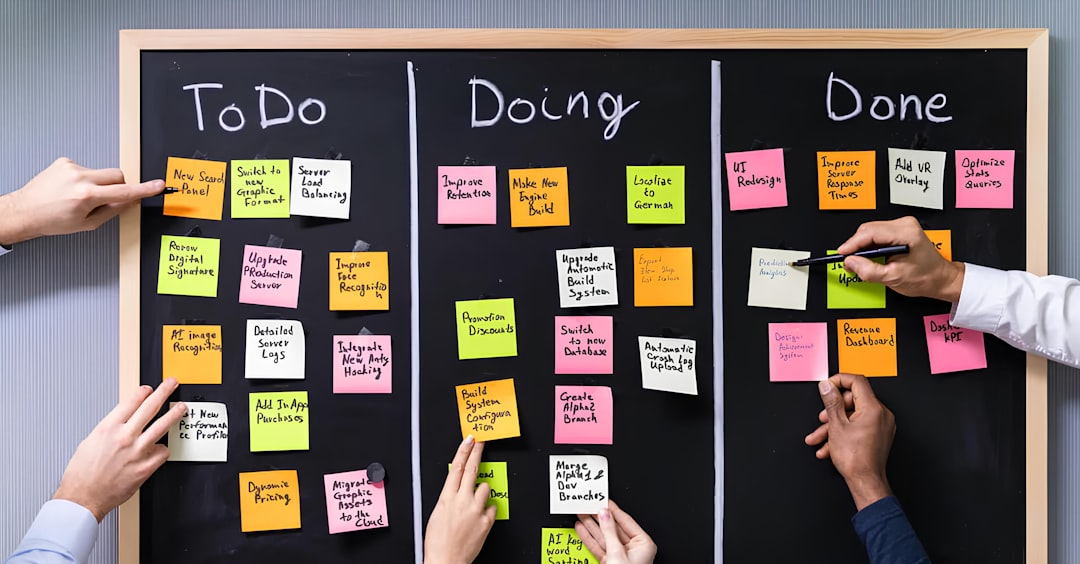 People using a kanban board for task management — representing curriculum change tracking between accreditation visits