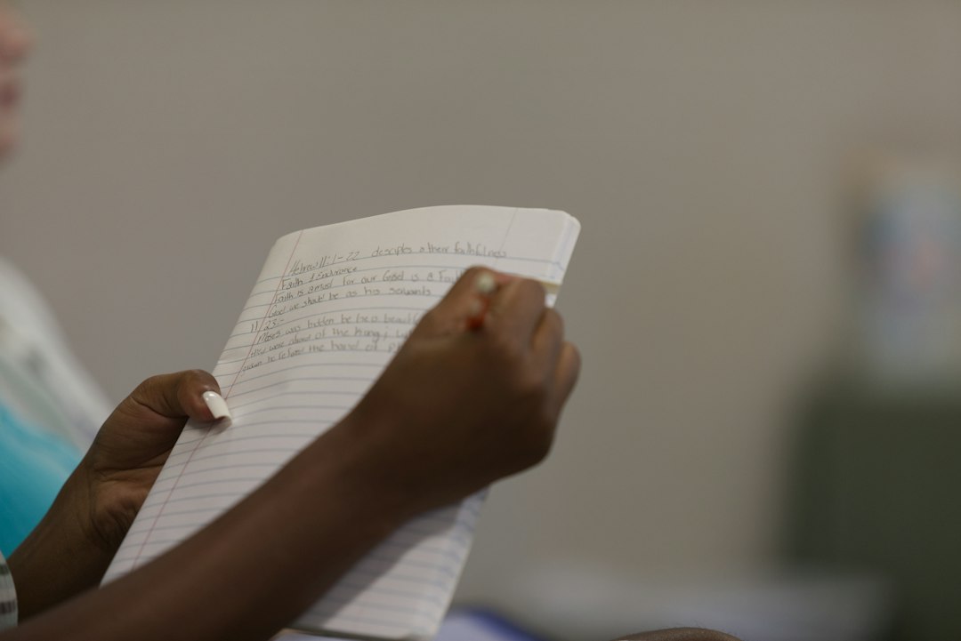 Hands reviewing a printed report, representing the three-year documentation window an SPE must maintain