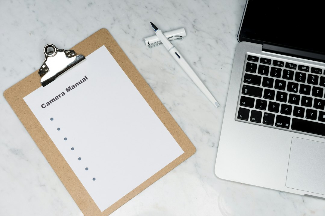 A clipboard with a checklist beside a laptop, tracking the ongoing maintenance of an evidence map